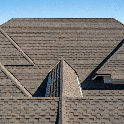 Close-up of a residential hip roof with multiple slopes meeting at a central ridge, emphasizing its strong, durable structure. Sunny day, no text, no words, no typography, 8K, natural lighting